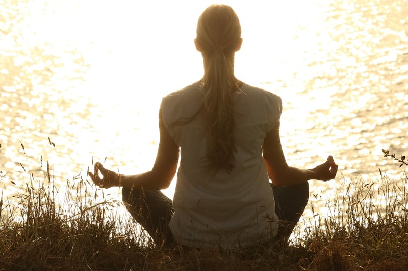 Yoga woman at sunset